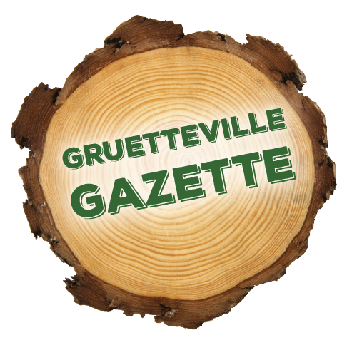 A wooden log with the words gruetteville gazette on it.